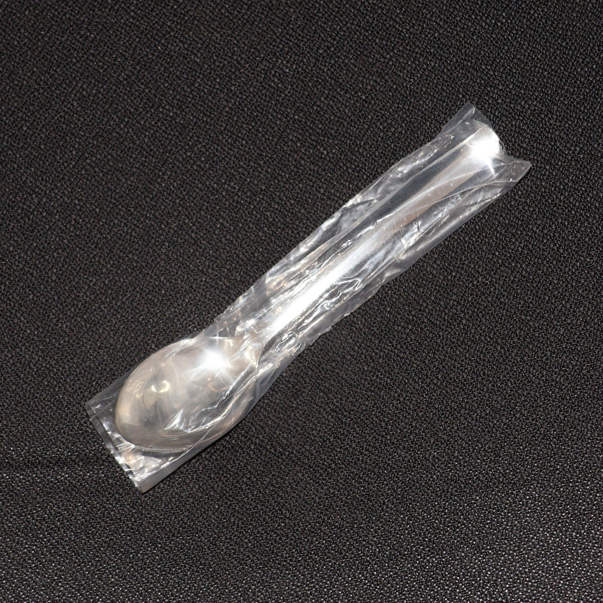 Stainless Steel Dining Spoon alongside other cutlery, ideal for home or café use.