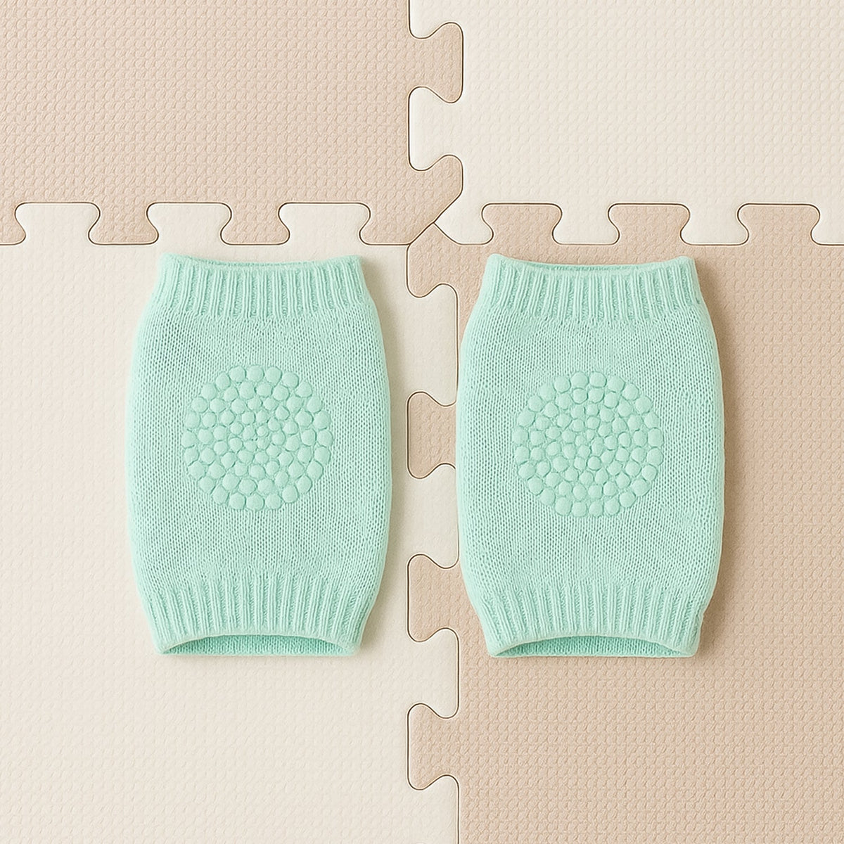 Close-up of soft mint green wool toddler knee protector leg warmers
